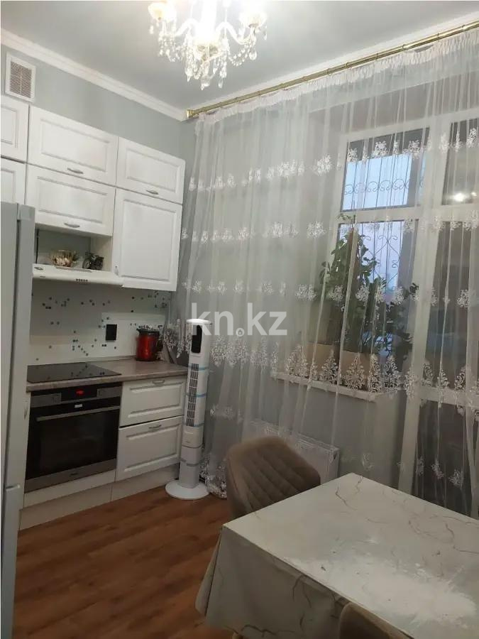 Продажа 2-комнатной квартиры, 52 м², ул. Толе би, дом  12/1 в Астане - фото 2
