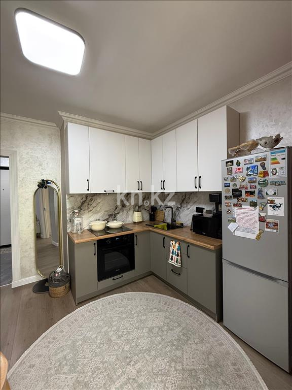 Продажа 2-комнатной квартиры, 52 м², ул. Толе би, дом  285/8 к13 - ул. Утеген батыра в Алматы - фото 21