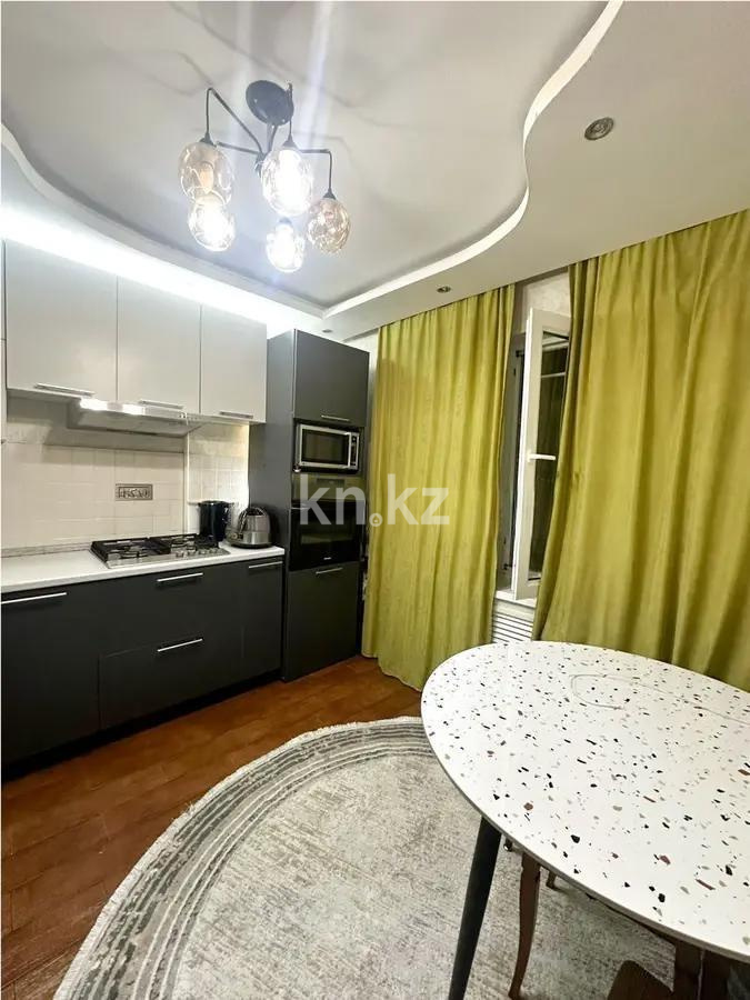 Продажа 2-комнатной квартиры, 52 м², ул. Тургута Озала, дом  49 в Алматы - фото 2
